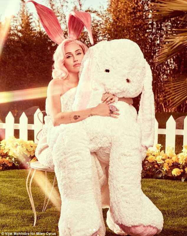 4AB3C0BC00000578-5563235-She_s_a_stunner_Miley_also_posed_with_a_giant_stuffed_bunny_rabb-a-164_1522439397865