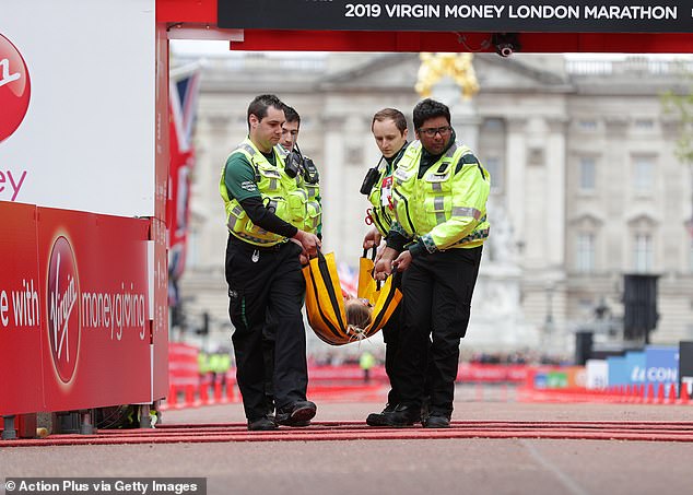 12816970-6971797-Paramedics_arrived_at_the_finish_line_shortly_after_to_put_her_o-a-32_1556540589913